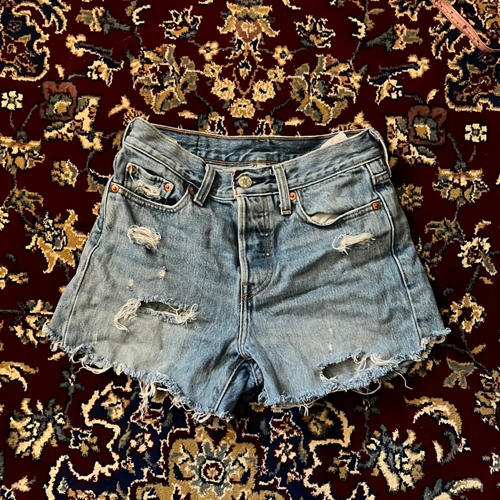Vintage Levi blue Denim shorts. High waisted shorts with 3 hidden button details